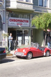 Doc Andy stands in front of his office on Divisadero Street